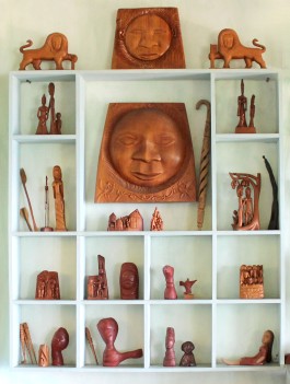 Assorted works by Zaccheus Powell, William "Woody" Joseph and others on shelf as displayed at Te Moana, Annabella and Peter Proudlock Collection